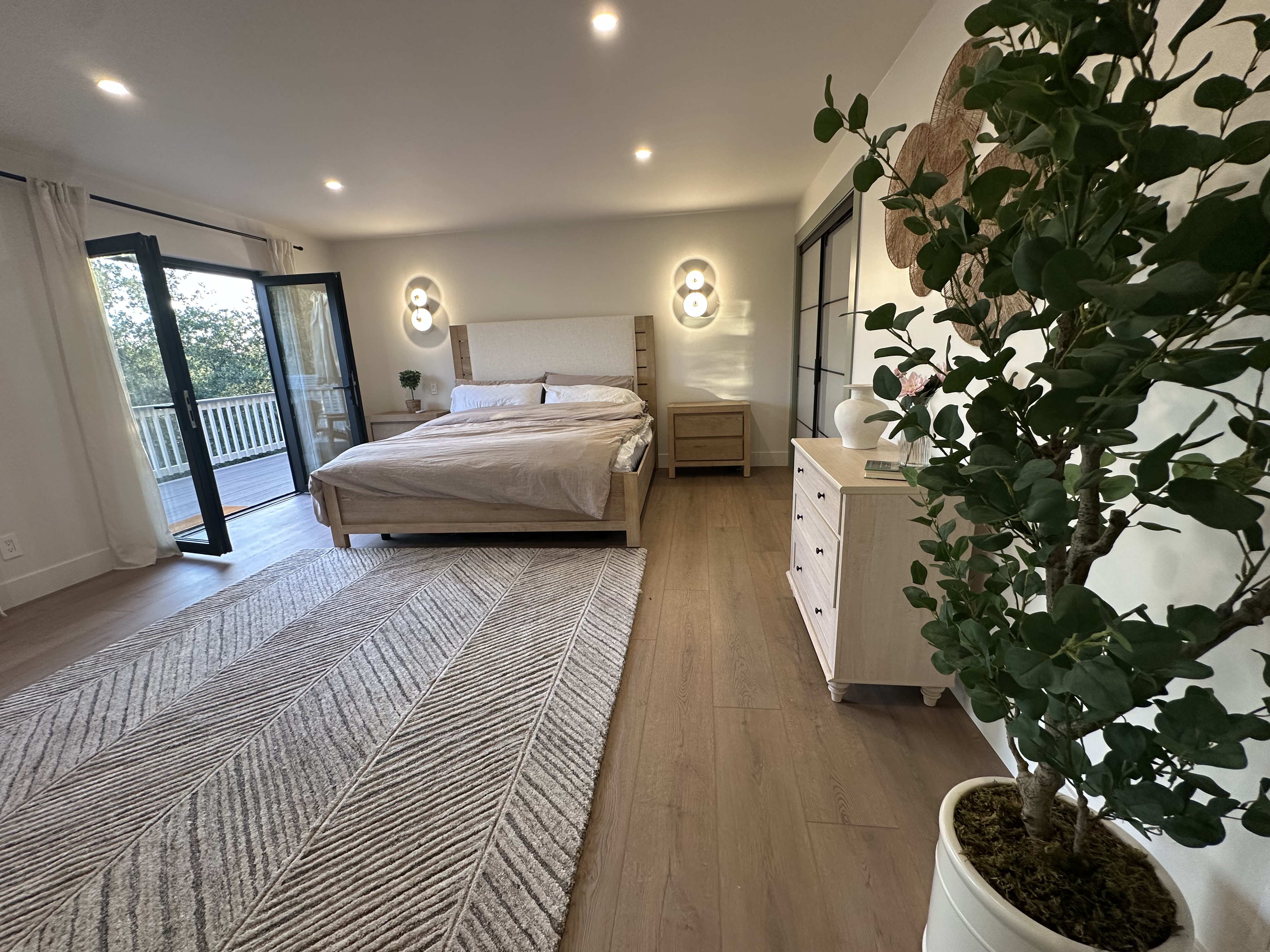 Primary bedroom with king bed and deck access